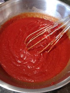 whisking ketchup ingredients together