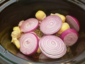 loading ingredients into crock pot